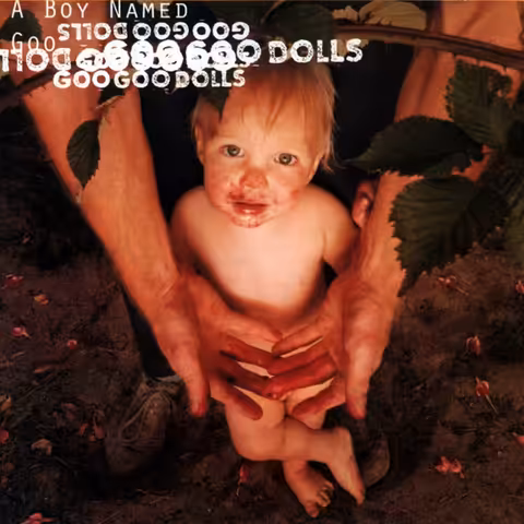 Front cover of A Boy Named Goo by Goo Goo Dolls (1995), a photograph by Gellert of a small child with blackberry juice smeared across his face and hands.