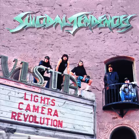 Lights...Camera...Revolution! album cover shot at the Vista Theatre in Los Feliz, three Suicidal Tendencies members perched on the marquee and two on the balcony above red letters reading Lights Camera Revolution
