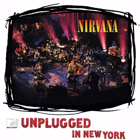 Front cover of MTV Unplugged in New York: Frank Micelotta's photograph of Kurt Cobain hunched over his 1959 Martin D-18E acoustic guitar, eyes closed, wearing the olive-green Manhattan mohair cardigan that has since become as famous as the album itself.