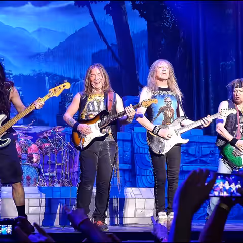 Iron Maiden performing live on stage in Madrid in July 2016, with Bruce Dickinson at the microphone.