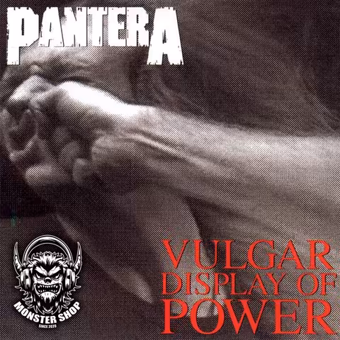 Front cover of Pantera's Vulgar Display of Power showing a bare fist striking a man in the face, photographed by Brad Guice.
