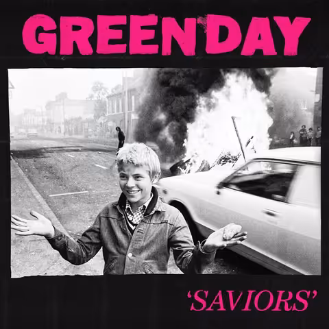 Front cover of Saviors by Green Day, featuring a modified 1978 Chris Steele-Perkins photograph of a Belfast youth holding a stone on Falls Road during the Troubles