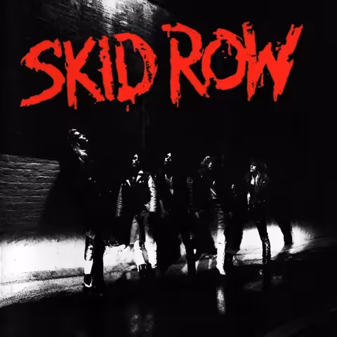 Front cover of Skid Row's self-titled 1989 debut album on Atlantic Records, featuring the band's bold orange script logo set against a stark photographic backdrop.