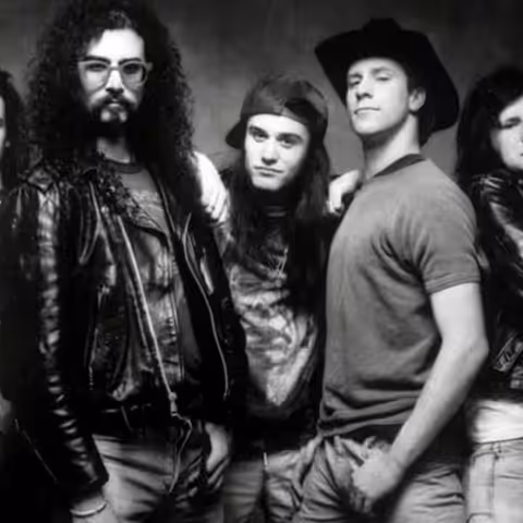 Faith No More band promotional photograph showing the classic Mike Patton-era five-piece lineup.
