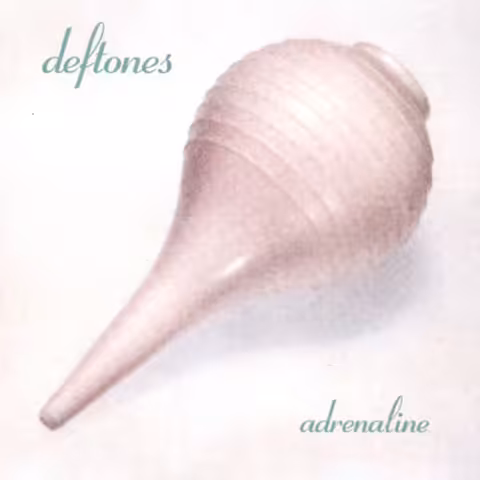 Front cover of Deftones' 1995 debut Adrenaline showing a pastel pink bulb syringe against a white background with the band logo and album title in blue.
