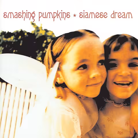 Front cover of The Smashing Pumpkins' 1993 album Siamese Dream: two young California-based child models, Ali Laenger and Lysandra Roberts, photographed by Melodie McDaniel wearing fairy wings and embracing cheek-to-cheek.