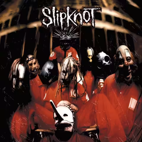 Front cover of Slipknot, photographed by Stefan Seskis, showing the cracked tribal-skull mask logo against a stark black background.