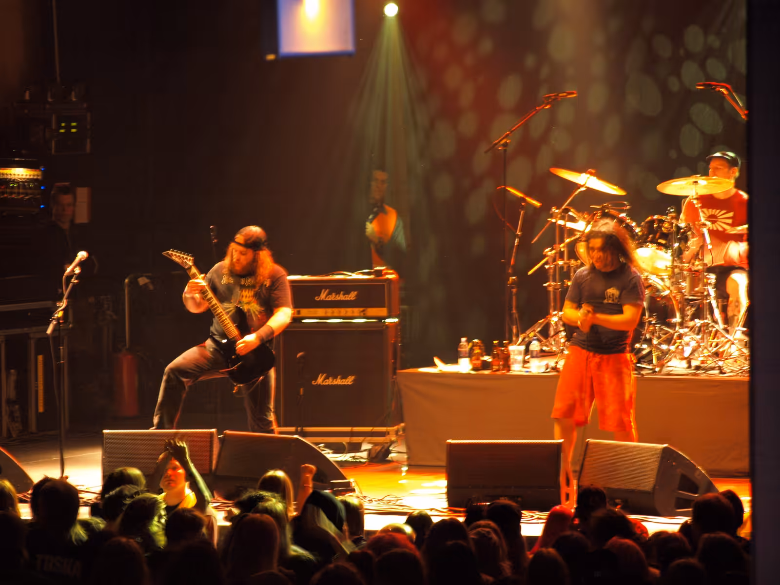Municipal Waste performing on a club stage with the crowd close to the band in 2008.