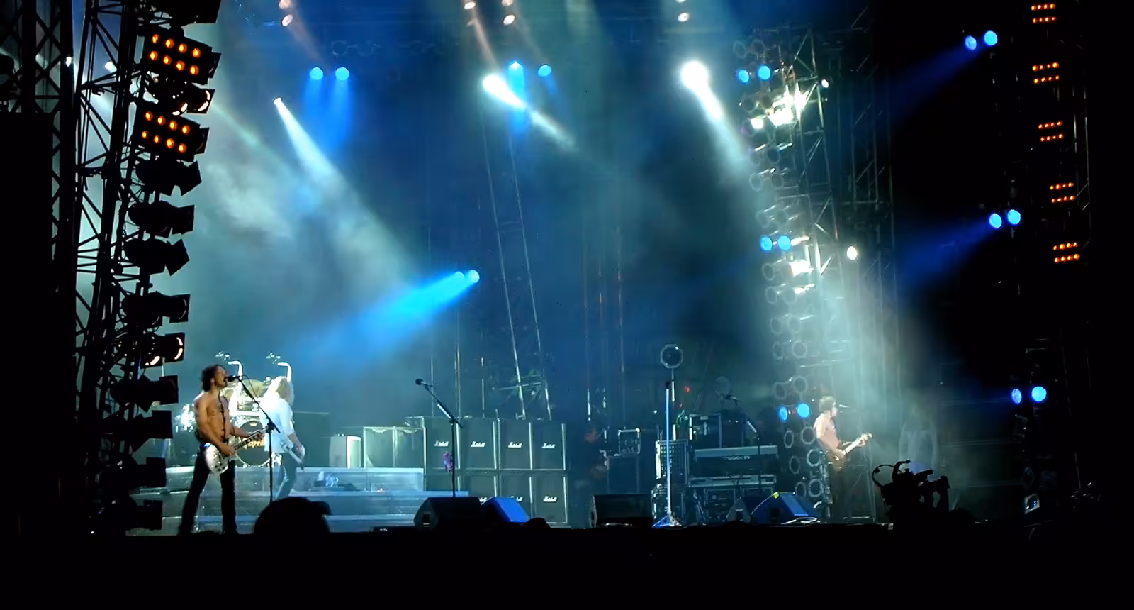 Def Leppard performing on a festival stage at Sweden Rock in 2008.
