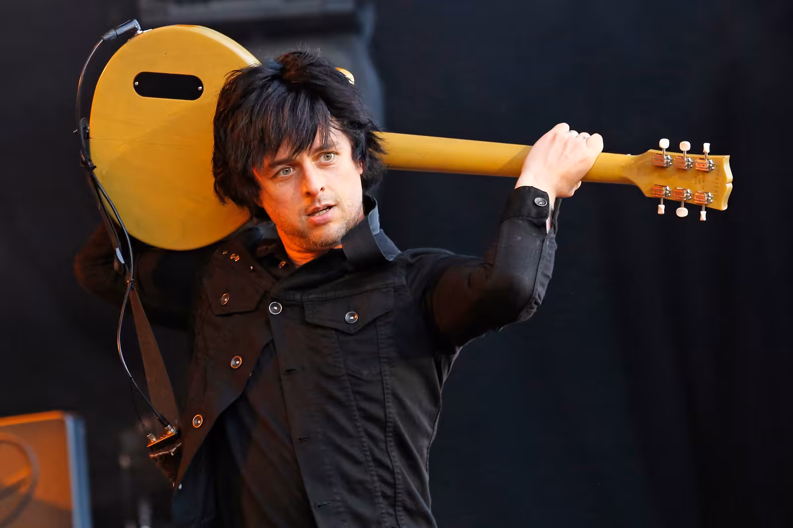Billie Joe Armstrong of Green Day singing into a microphone on stage at Rock im Park in Germany in 2013.