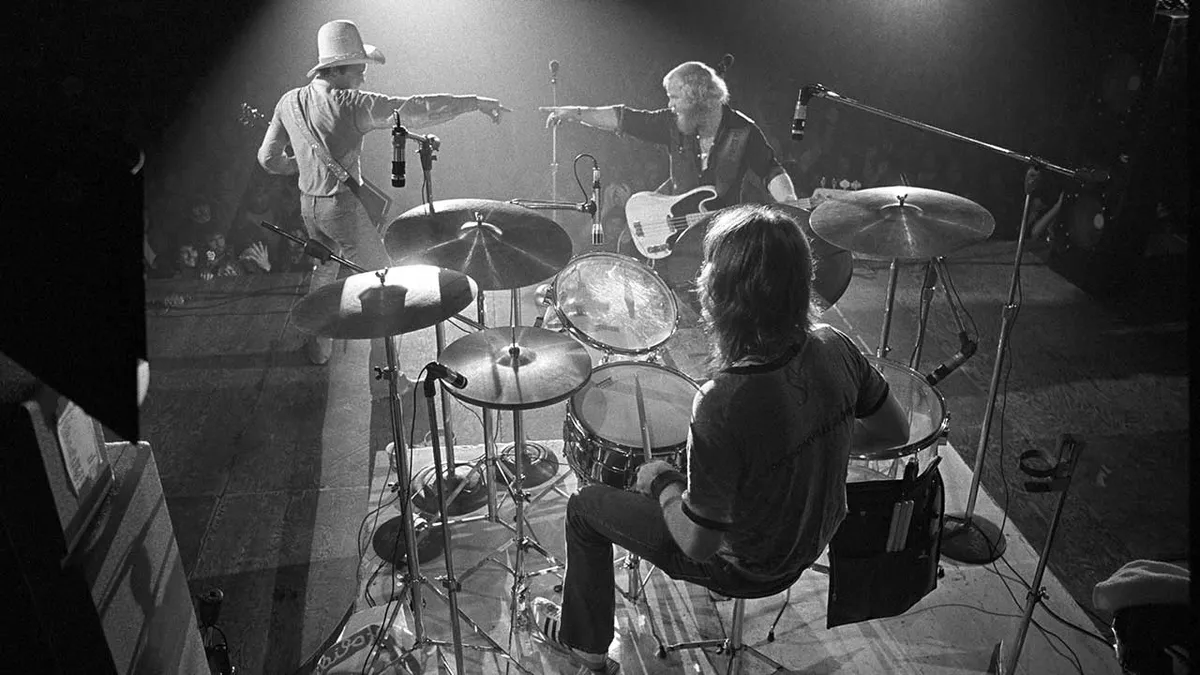 ZZ Top performing live at Georgia Southern College on 10 October 1973, photographed by Tom Hill: Billy Gibbons on guitar, Dusty Hill on bass and Frank Beard on drums in mid-set on a low theatre stage.